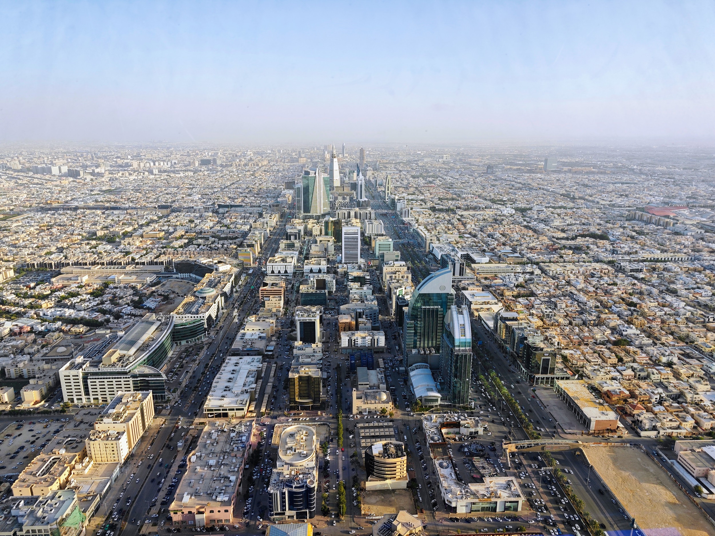 Panoramic view of Riyadh's skyline showcasing modern urban development, a perfect example of how digital twin technology can revolutionize real estate planning and visualization in Saudi Arabia's capital city.